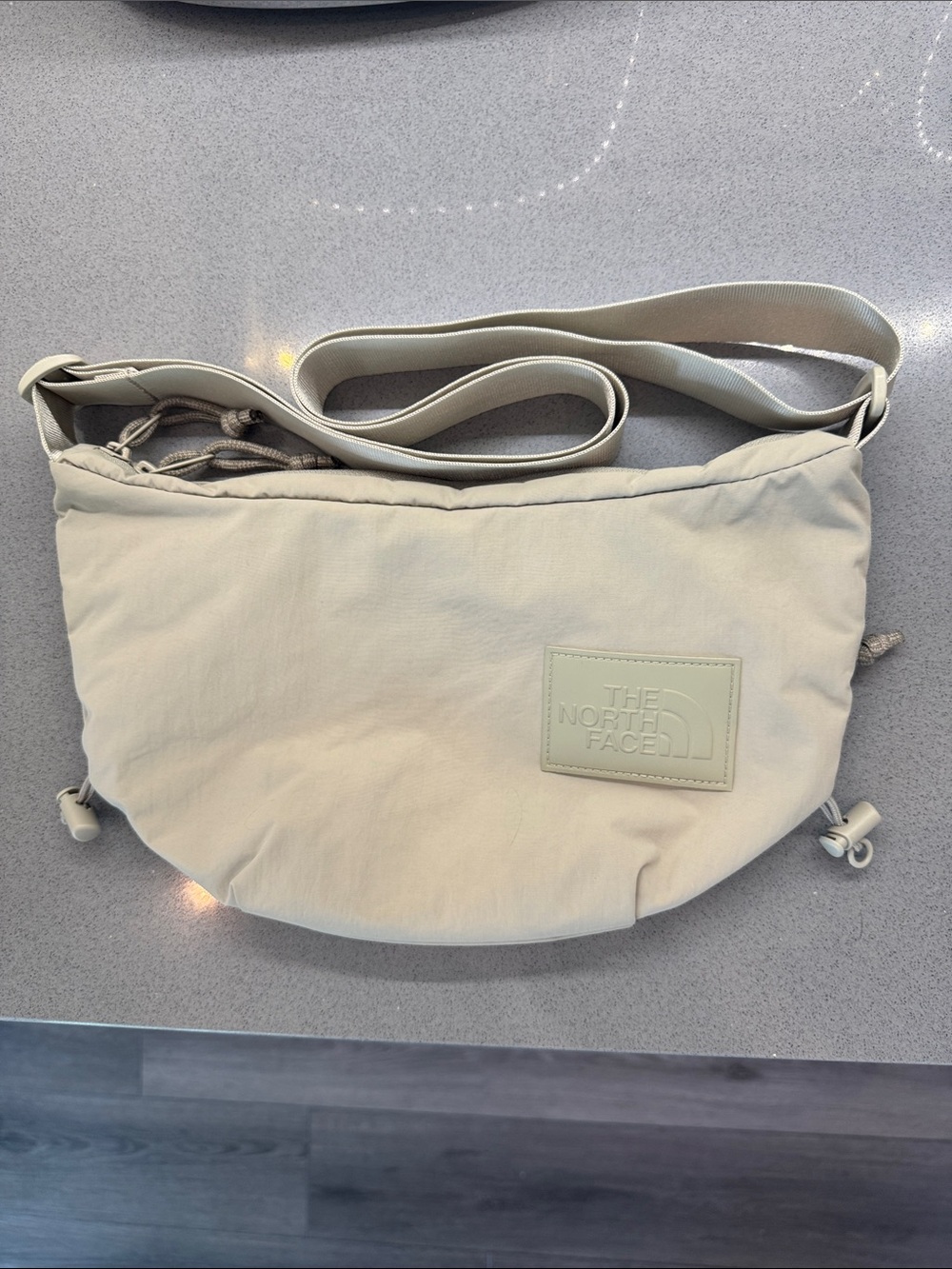 The North Face Women's Light Cream Crossbody Bag